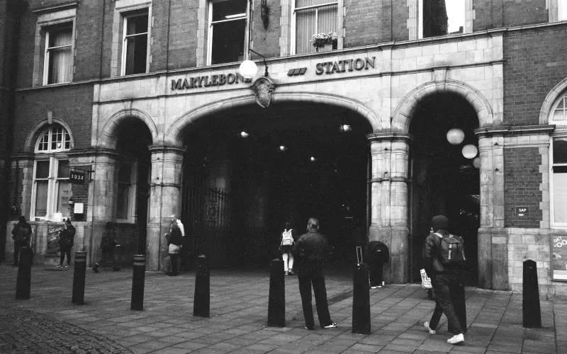 People are standing outside a building with a sign that says "Marylebone Station."