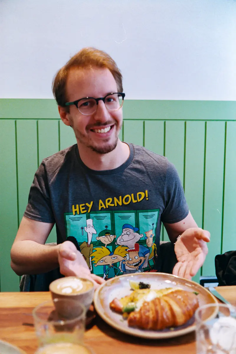 Portrait of  juan with croissant and coffee